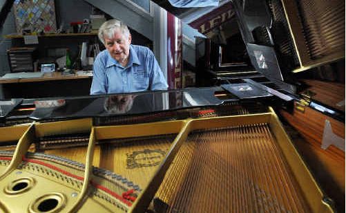 A real tickler: Rueben Fox with a reconditioned grand piano up for auction today. A real tickler: Rueben Fox with a reconditioned grand piano up for auction today.